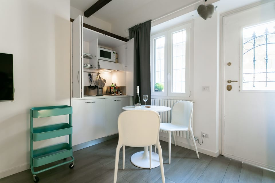 Basic Apartment Viale Coni Zugna 52 | Private kitchen | Full-size fridge, microwave, oven, stovetop