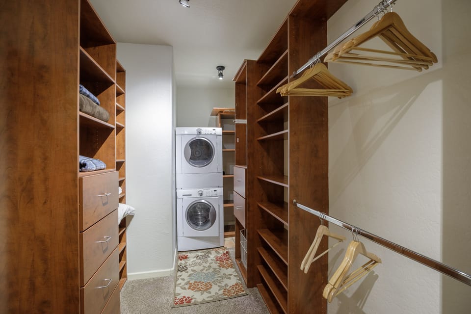 Primary suite 1 with a huge closet and private washer/dryer.