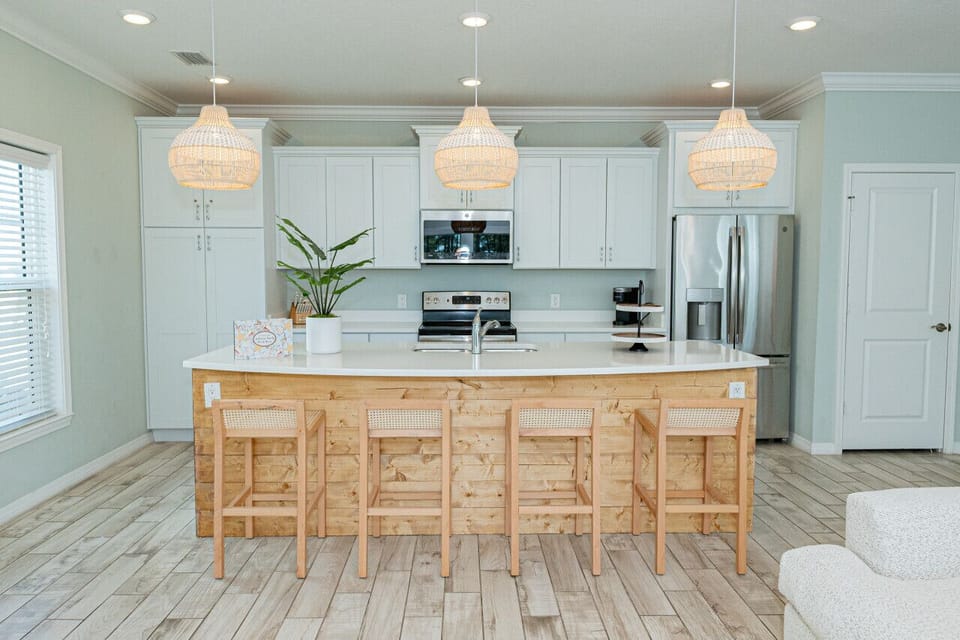 Create culinary magic in our stunning kitchen. Gather around the island and share delicious meals with loved ones.epare delicious meals and gather around this spacious kitchen island. Plenty of counter space and seating for everyone.