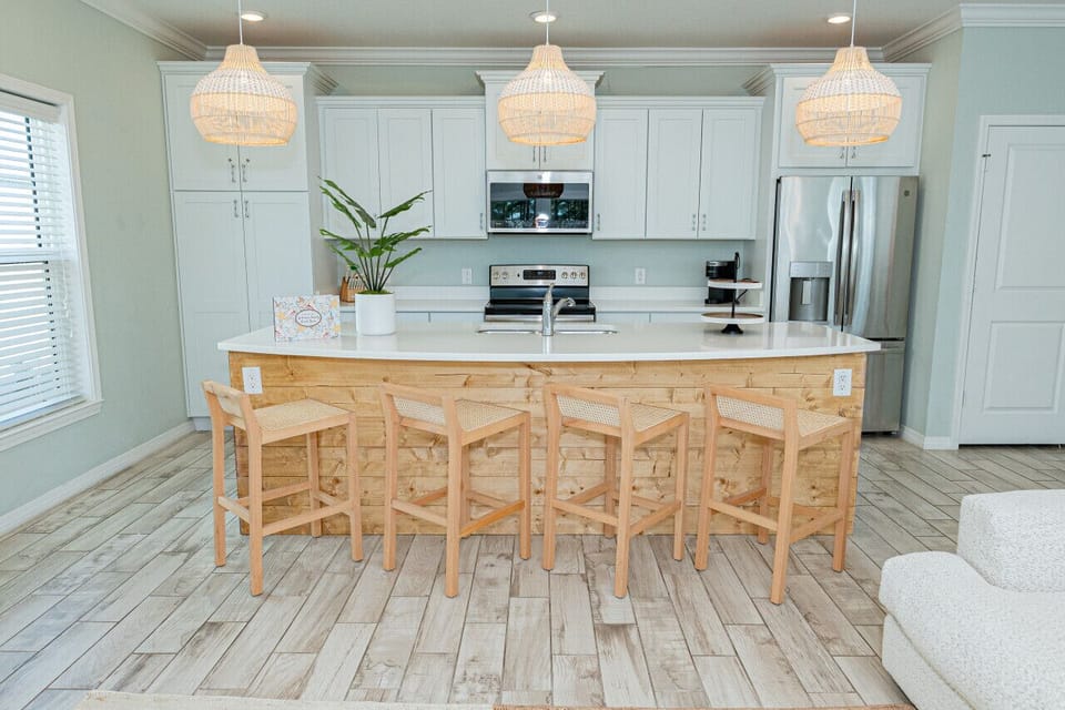 Prepare delicious meals and gather around this spacious kitchen island. Plenty of counter space and seating for everyone.