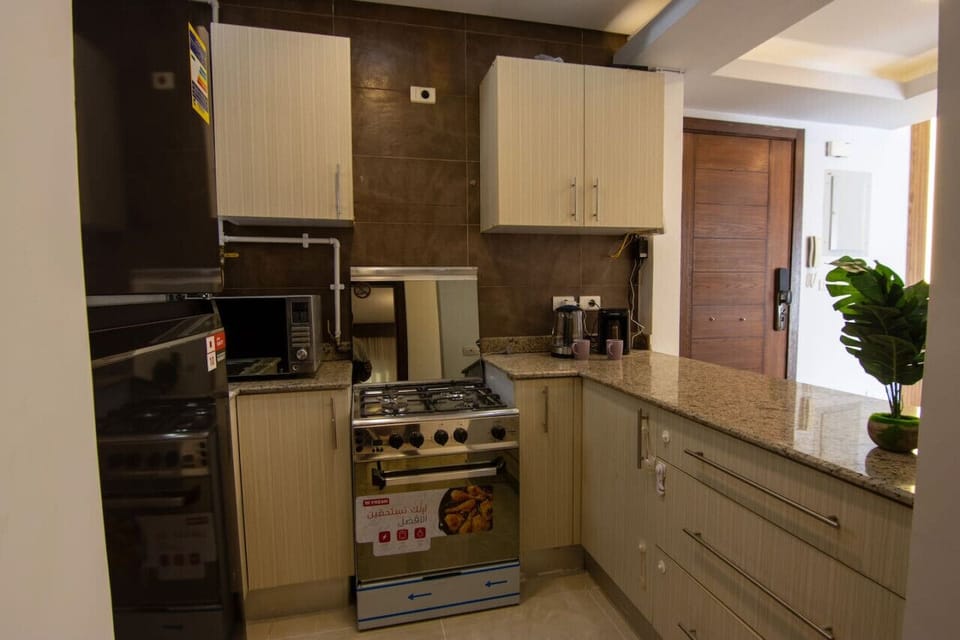 Fridge, microwave, oven, cookware/dishes/utensils