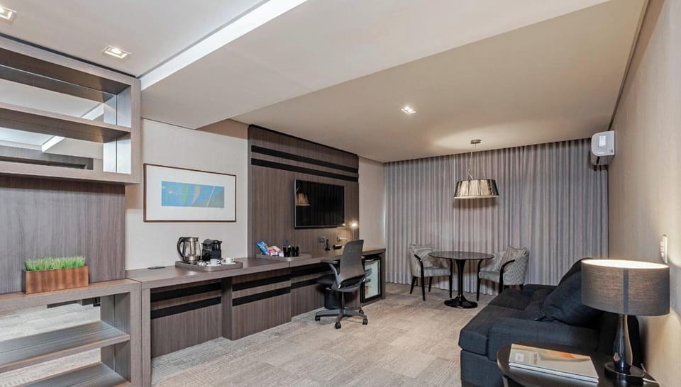 Superior Apartment | Living area | 50-inch TV with cable channels