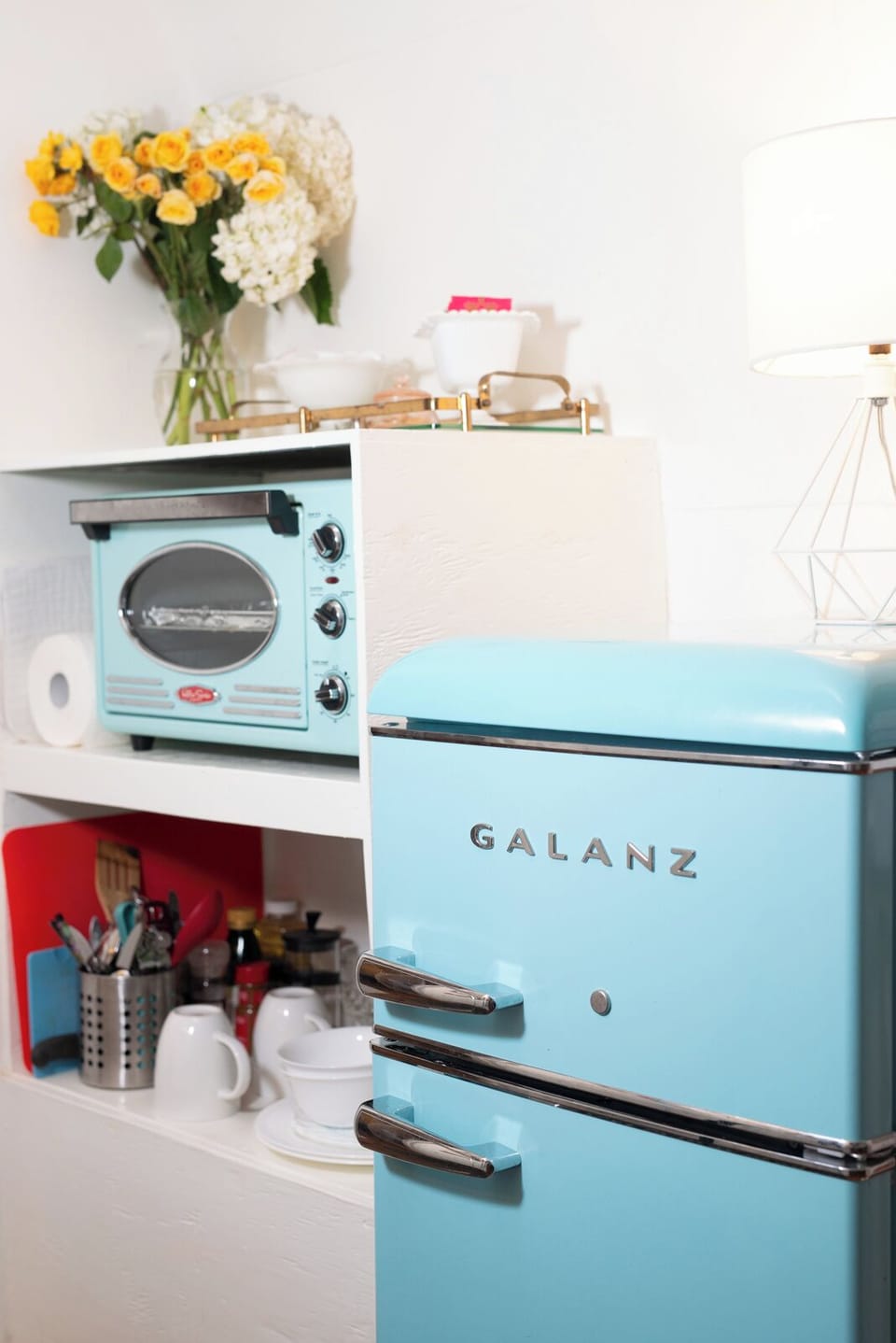 Large toaster oven, pots and pans, dishes utensils, mini fridge, induction stove