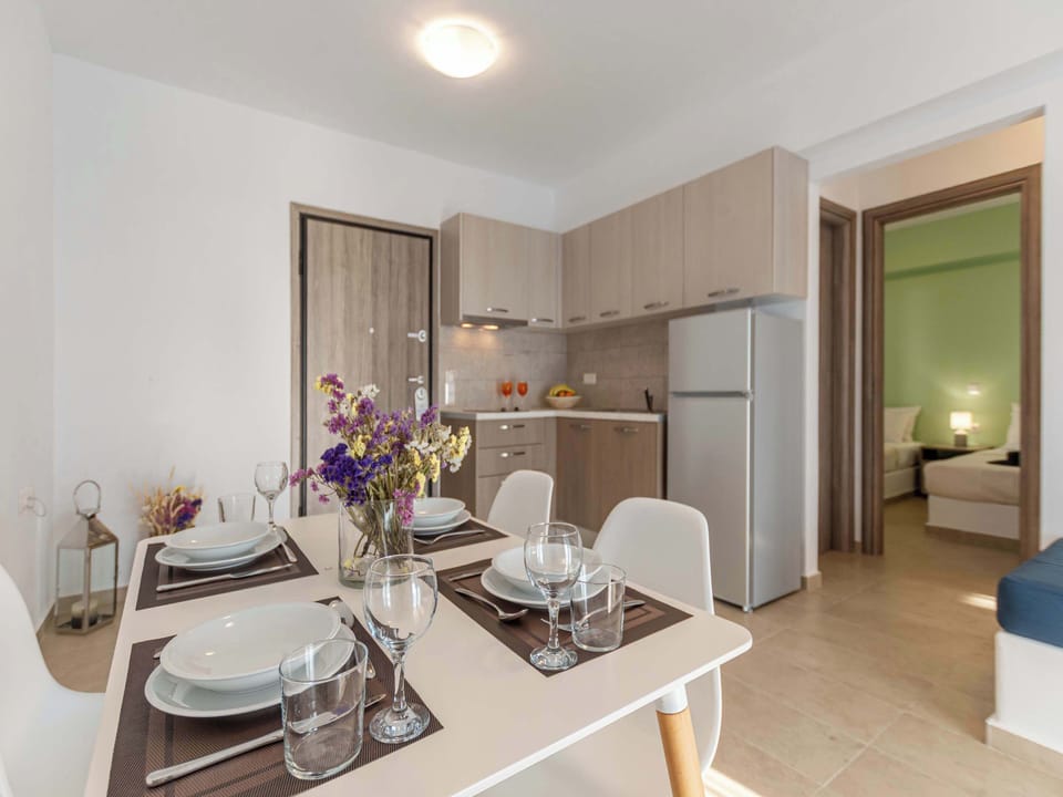 Family Apartment, 2 Bedrooms | Private kitchen | Full-size fridge, stovetop, electric kettle, cookware/dishes/utensils