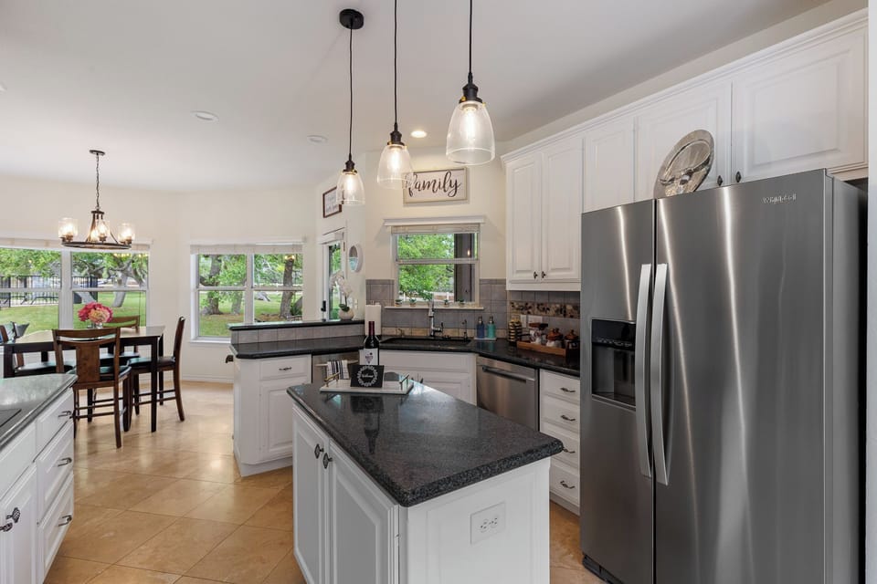 Spacious kitchen dishwasher, dbl oven, glass cooktop and trash compactor 