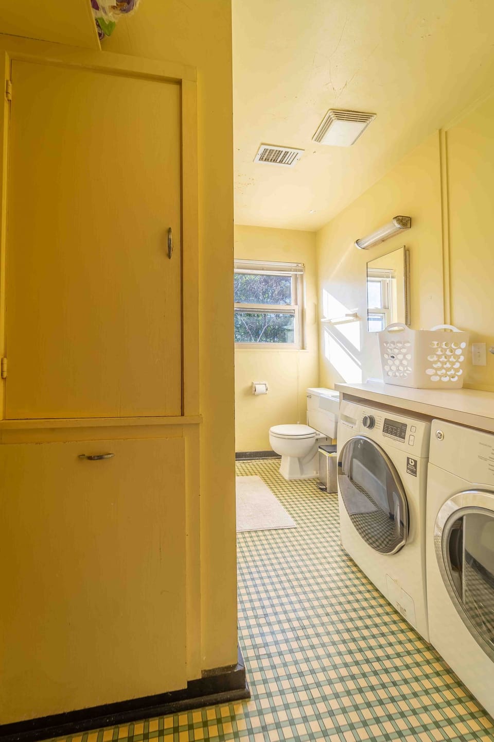 Bathroom with washer and dryer