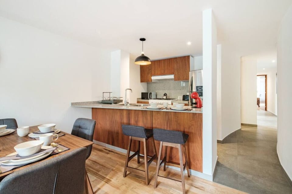 Kitchen and kitchen bar with stools