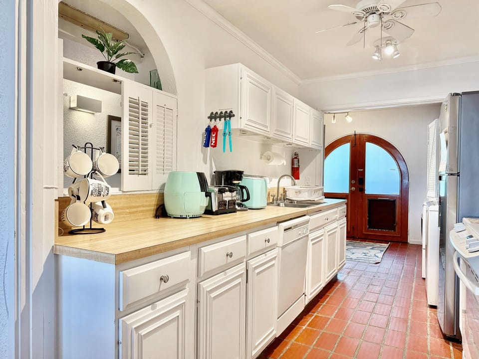 Kitchen with dishwasher, stove and microwave/convection oven combo.