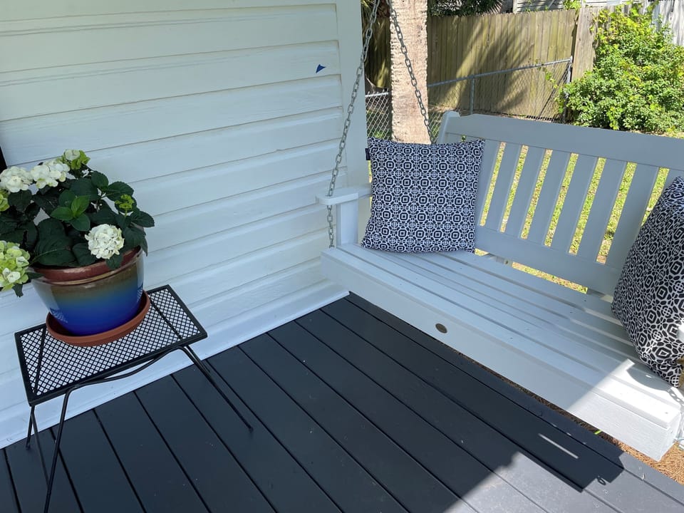 Breezy front porch with comfy swing.