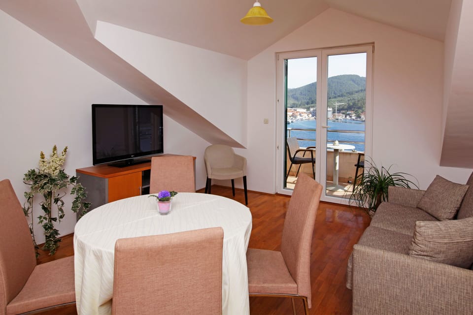 One-Bedroom Apartment Balcony Sea Vew | Living area | Flat-screen TV