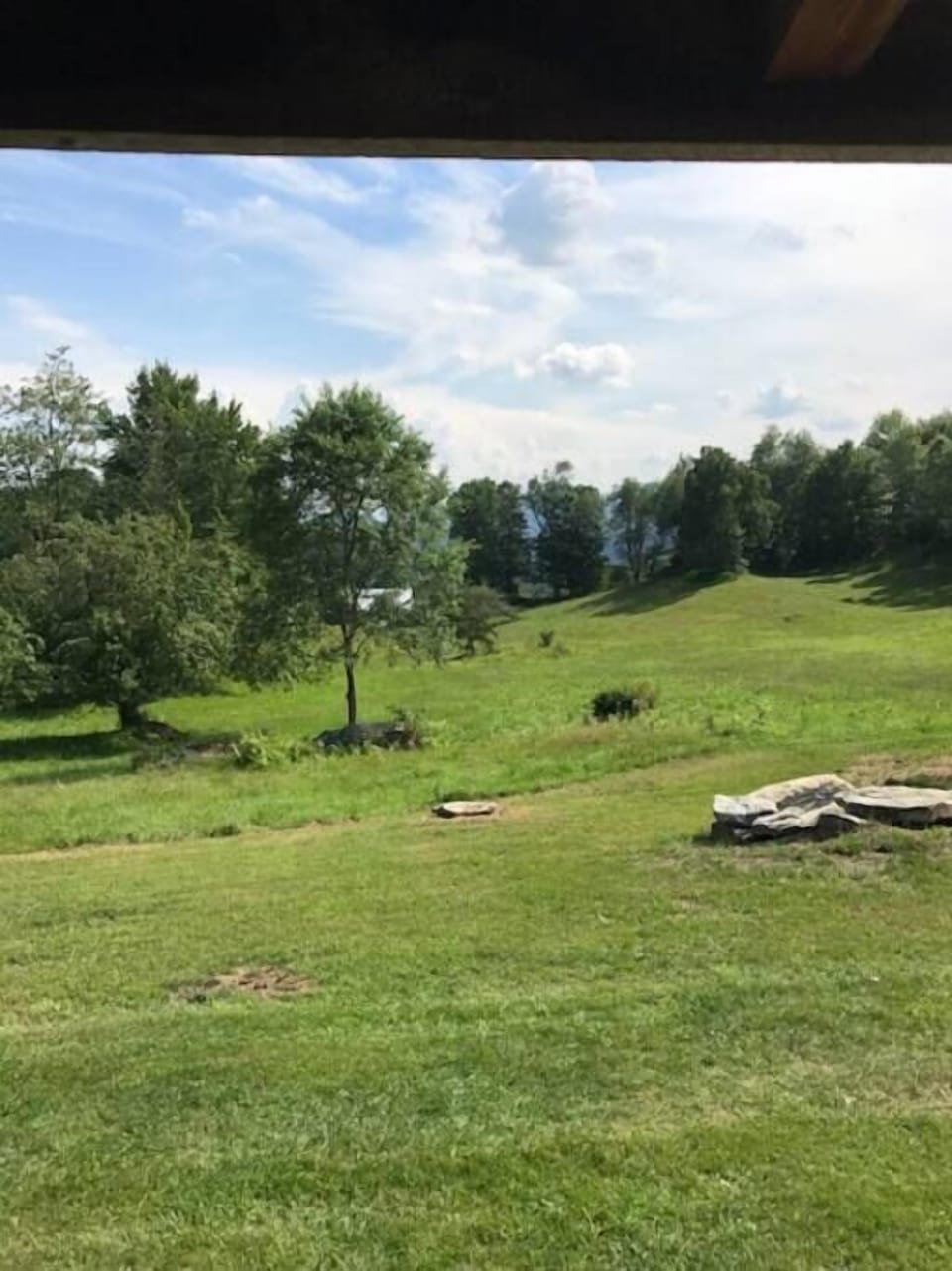 View from cabin porch, fire pit front right