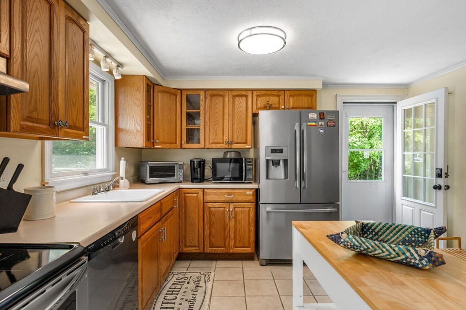 Enter this home into a fully equipped kitchen.
