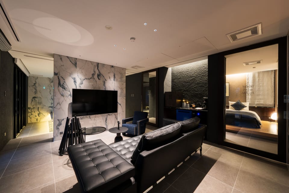 Premier Suite | Living area | 65-inch flat-screen TV with digital channels, heated floors