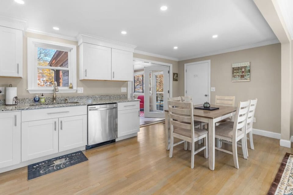 Dining table with seating for six, located next to the living room & kitchen.