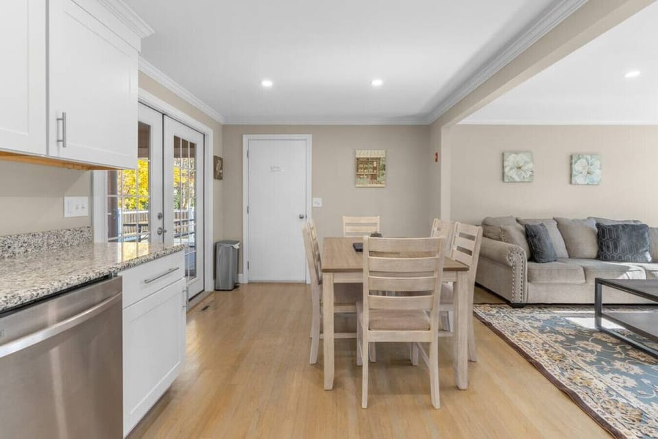 Dining table with seating for six, located next to the living room & kitchen.