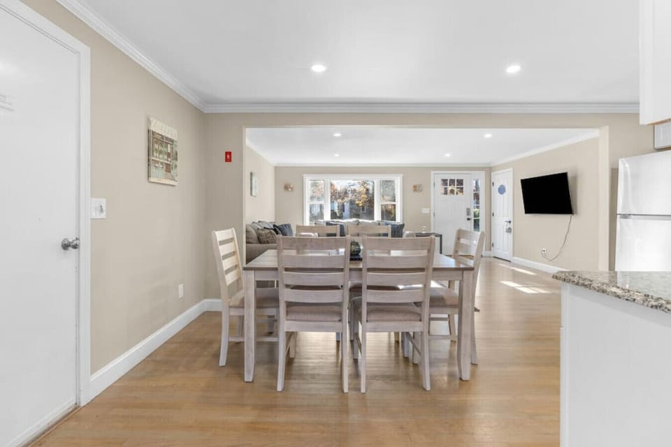 Dining table with seating for six, located next to the living room & kitchen.
