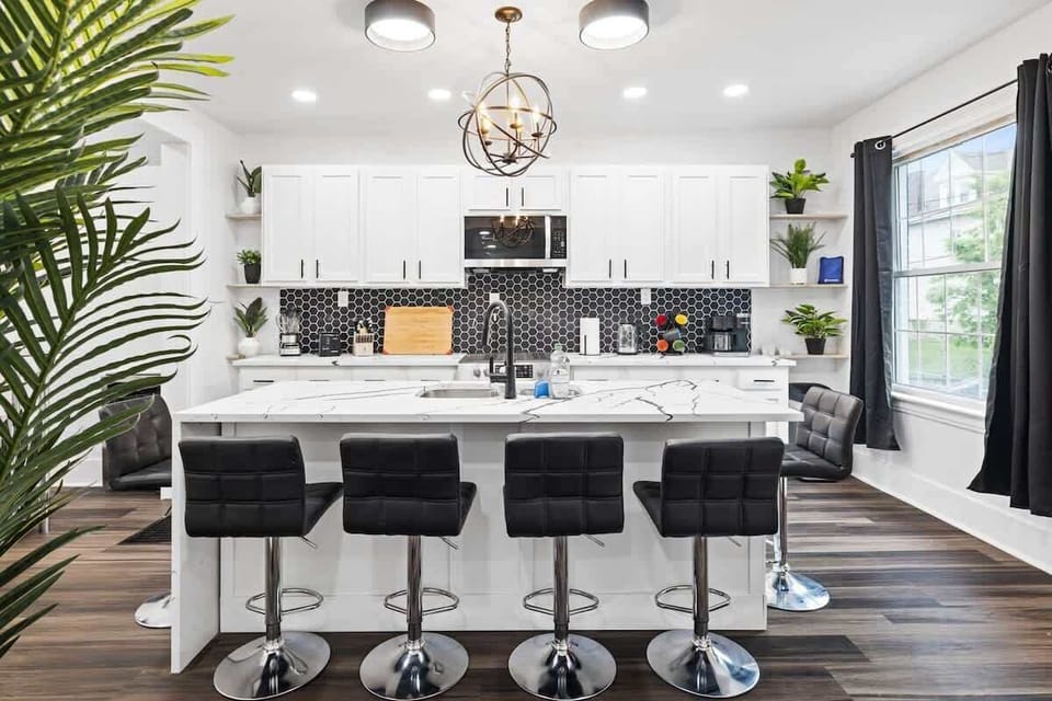 What's a home without a widely welcoming kitchen with chic seaters.
Bask in this beauty!