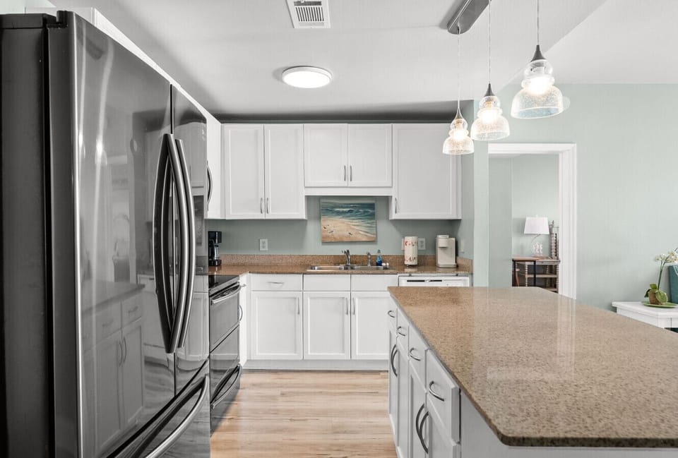 Fully equipped modern kitchen with stainless steel appliances and plenty of counter space.