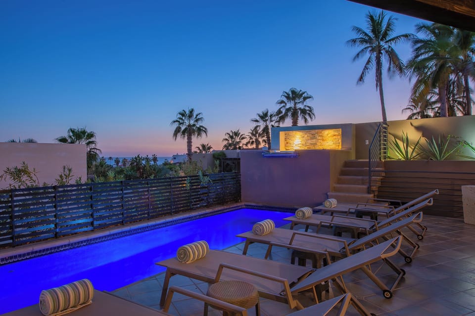 Poolside patio with gorgeous ocean views during sunset