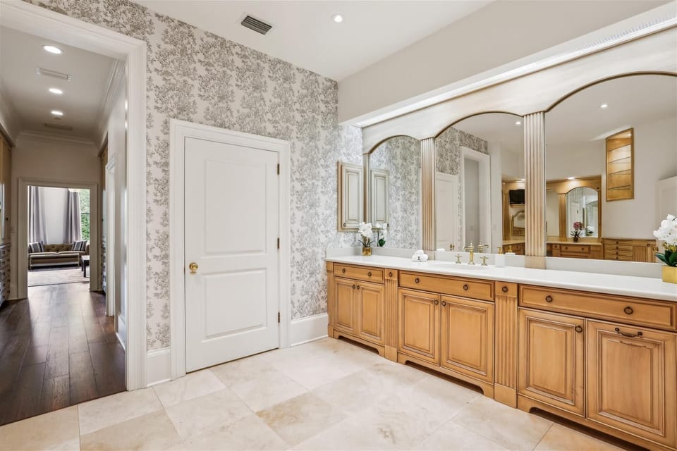 Master Bathroom - This is the area with sink and vanity. Door in picture is to the toilet room.