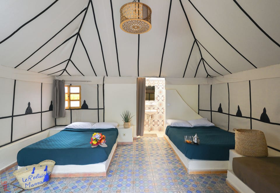 Deluxe Tent | Blackout drapes, bed sheets