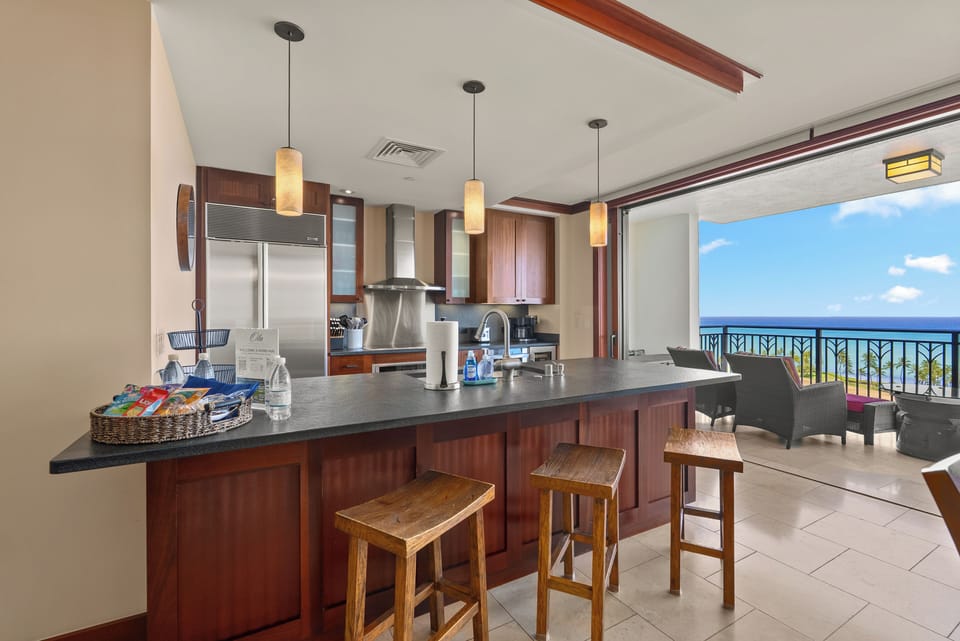Pull up a stool at the breakfast bar, ocean in view while dinner comes together.