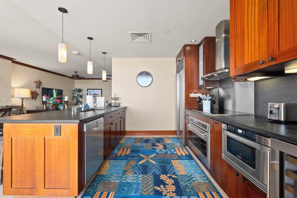 Full stainless range and a run of counter, built for real cooking after a beach day.