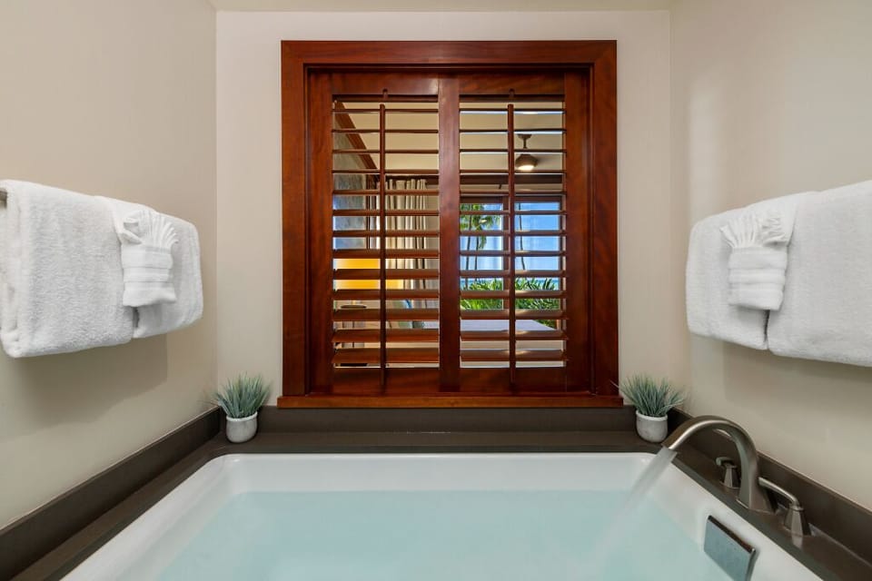 The large soaker tub, dual vanity and walk in shower provide primary ensuite luxury.