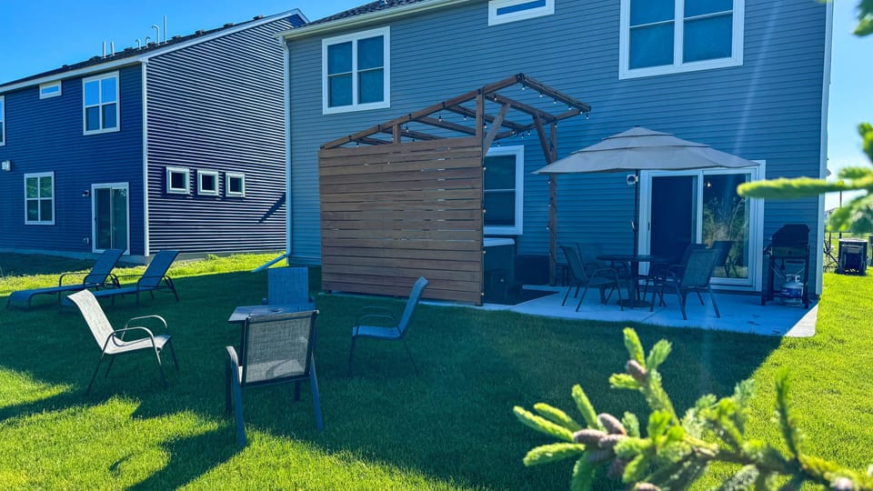 Back yard with plenty of room for yard games, and gas fire.
