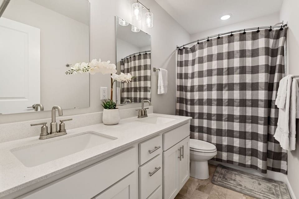 Upstairs bathroom with tub and shower