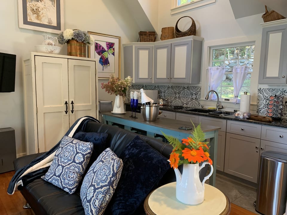 Kitchen equipped for cooking, stove, ninja oven, coffee maker, refrigerator etc