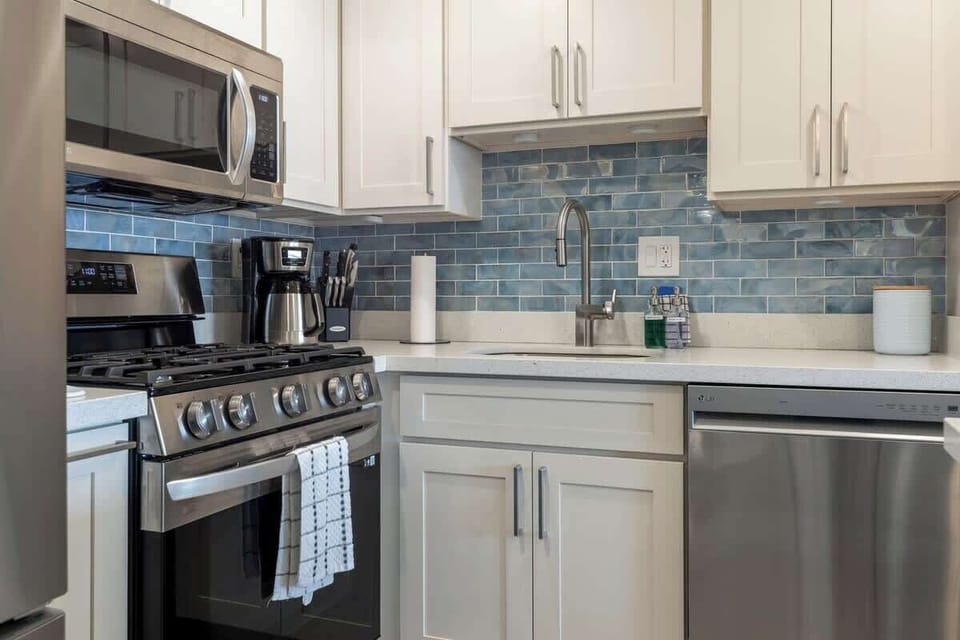 Beautifully remodeled fully equipped kitchen with stainless appliances.