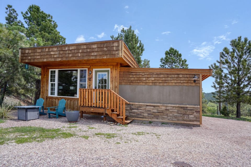 Relax in Adirodacks in front of your cozy cabin.