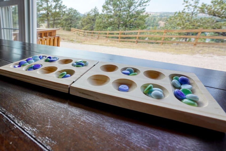 Play a game of mancala with a stunning view.