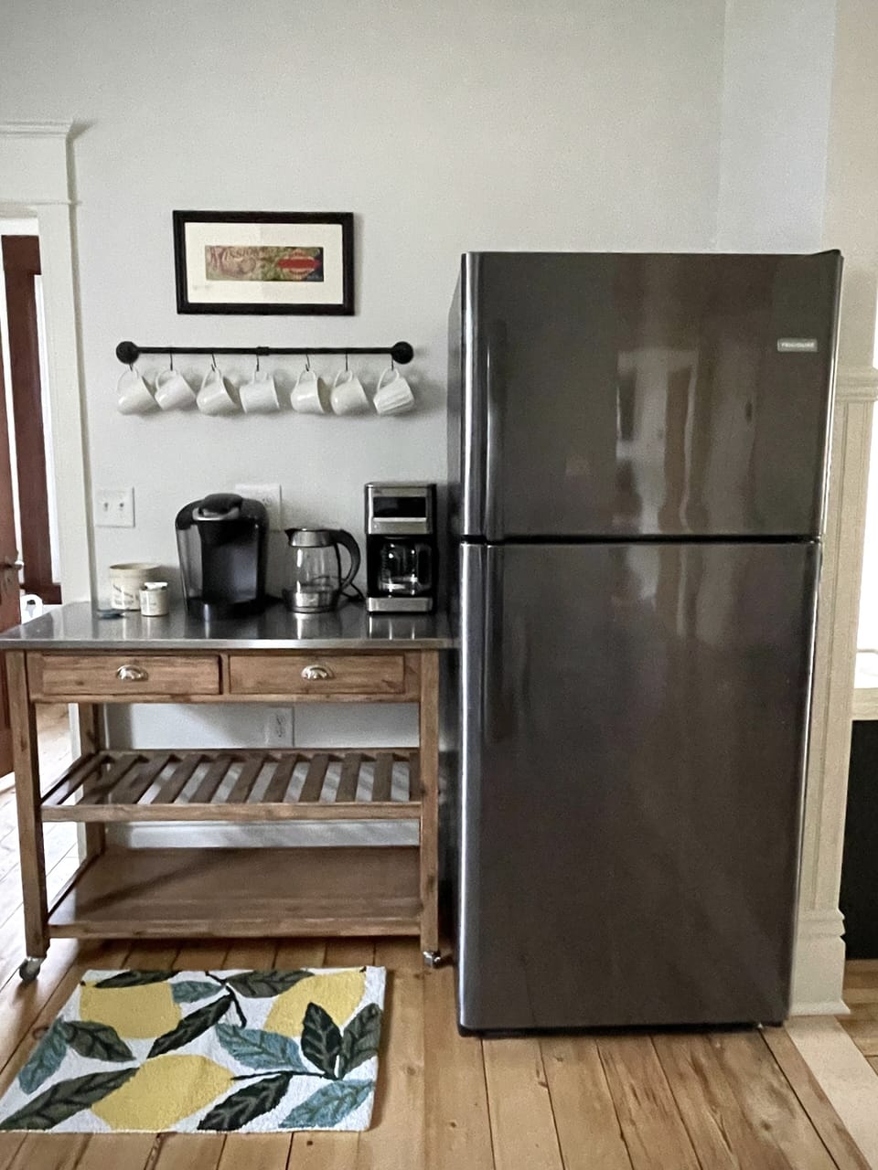 Coffee bar with Keurig, drip coffee pot, and electric kettle.