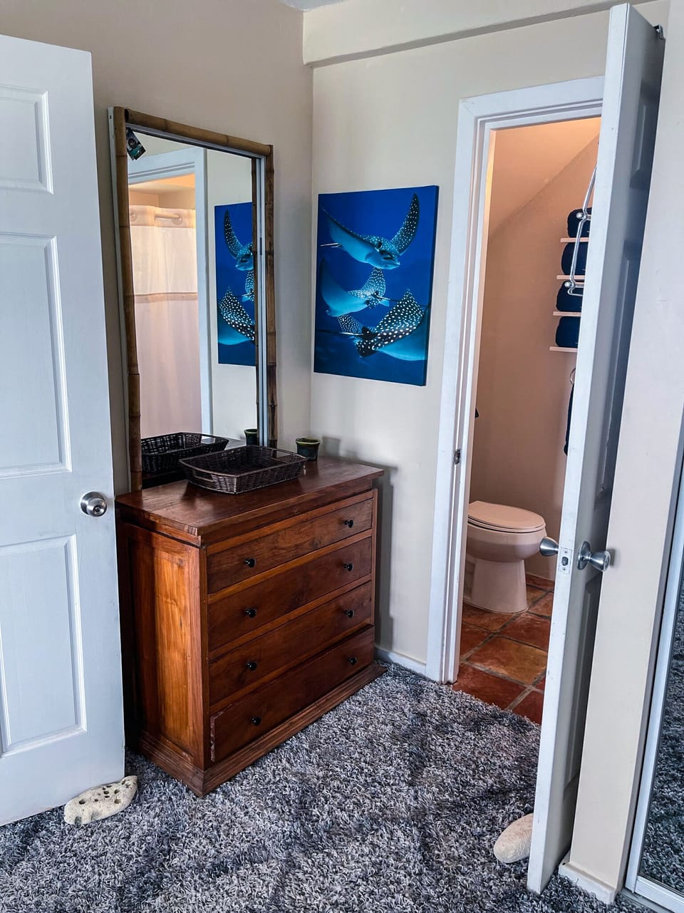 Primary Bedroom Dressing Area with mirror and full length mirrored closet doors