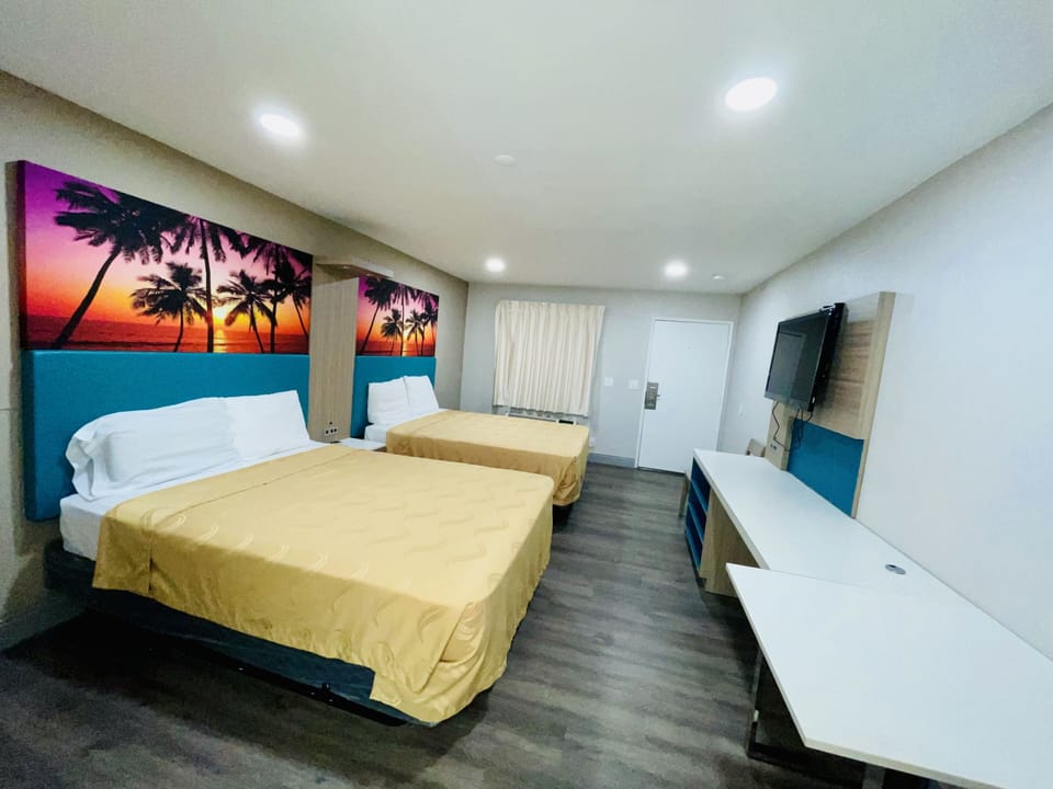Standard Room, 2 Queen Beds | Desk, laptop workspace, free WiFi, bed sheets