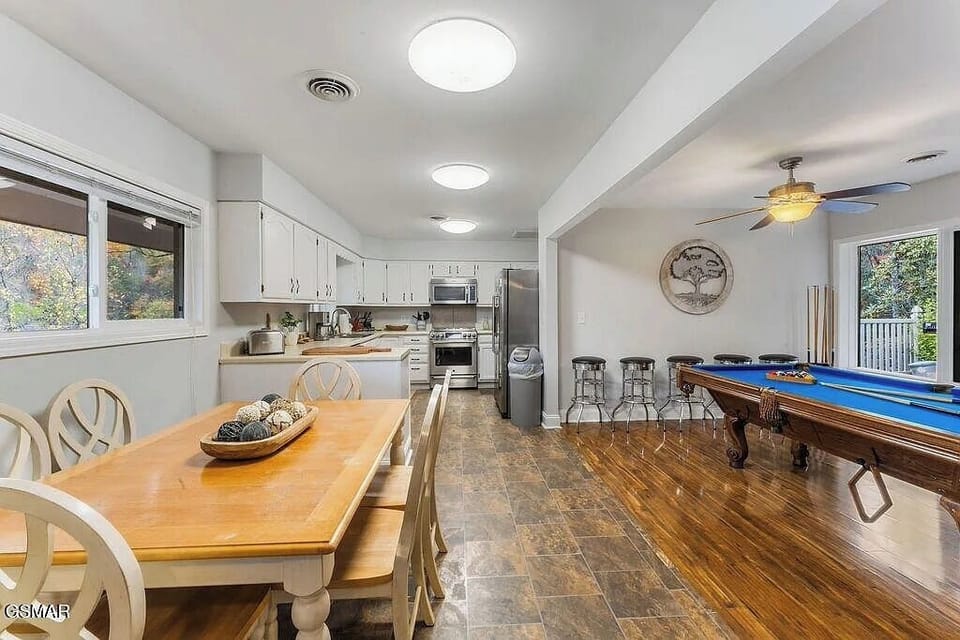 Your spacious retreat combines a fully equipped kitchen, dining area, and game room - perfect for memorable gatherings with family and friends.