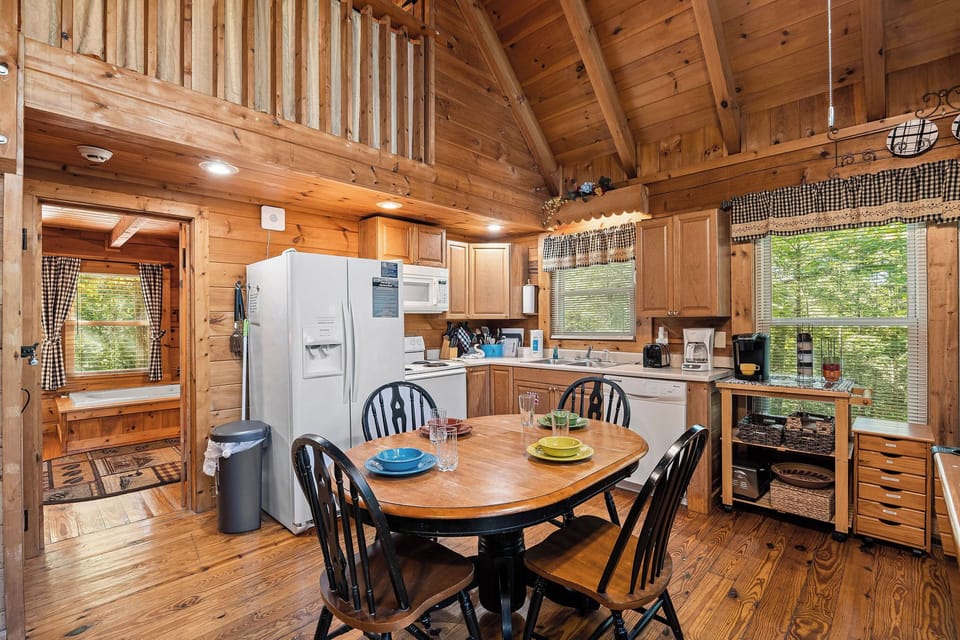Dining room space with seating for four in the great room at Cloud 9, a 1-bedroom cabin rental located in Pigeon Forge