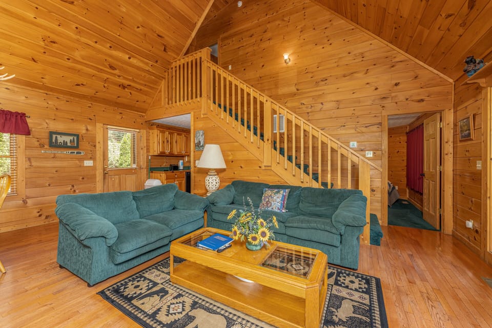 Sofa, loveseat, and coffee table at Cub's Crossing, a 3 bedroom cabin rental located in Gatlinburg