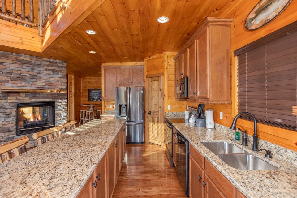Kitchen and Bar with Double-Sided Fireplace Shared with the Living Room in the Kitchen