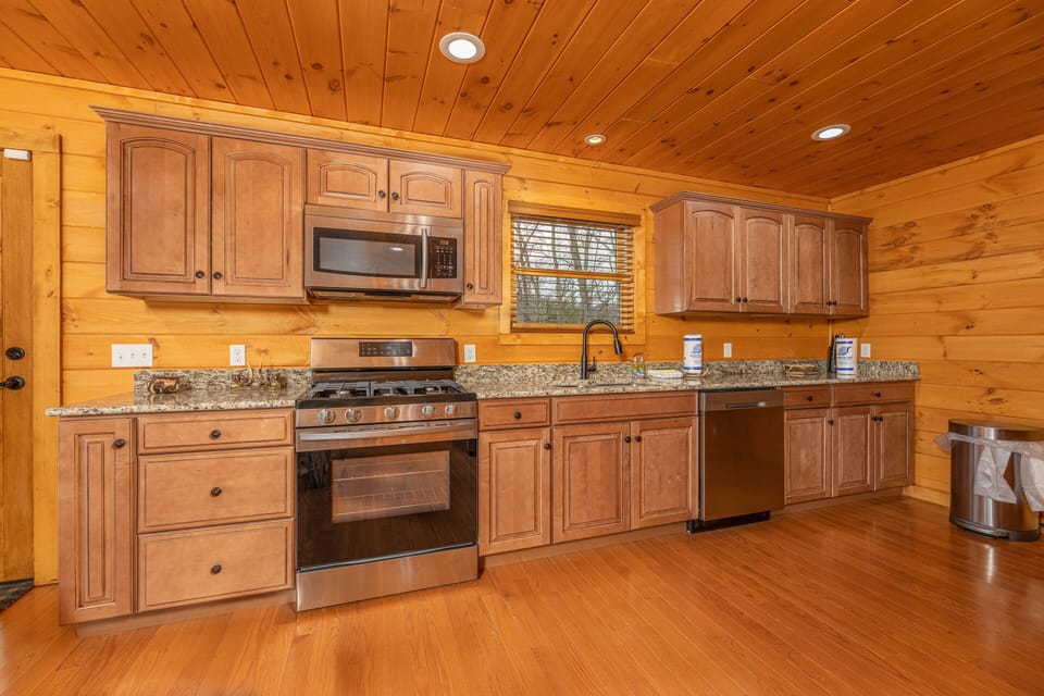 Kitchen with stainless appliances and granite counters