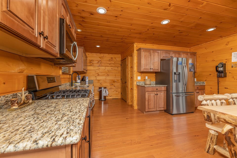 Kitchen with stainless appliances and granite counters