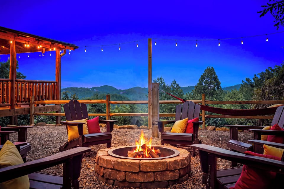 Gather around the crackling fire as twilight settles over the mountains, where Adirondack chairs invite you to sink in and savor the peaceful retreat with a warm drink in hand.