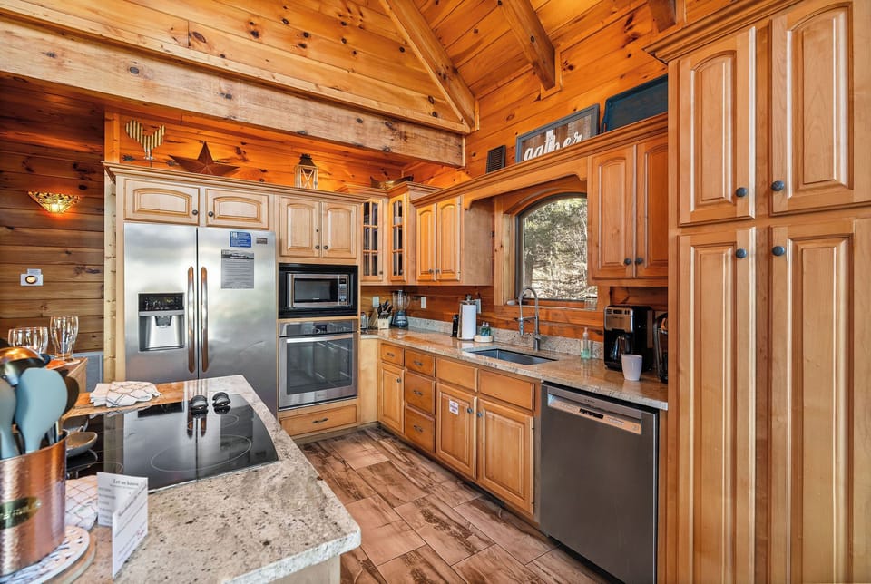 Kitchen with stainless appliances at Mountain Mama, a 3 bedroom cabin rental located in Pigeon Forge