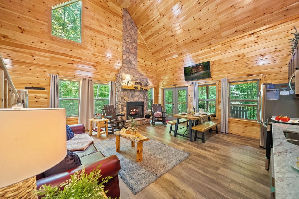 OPEN CONCEPT with a fireplace, sofa bed, dining, natural lighting & views