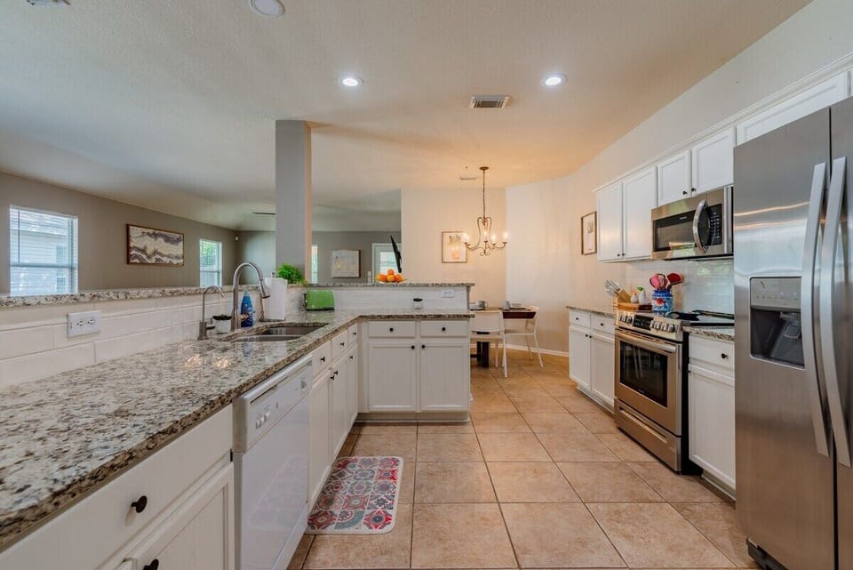 Well equipped walk-through kitchen