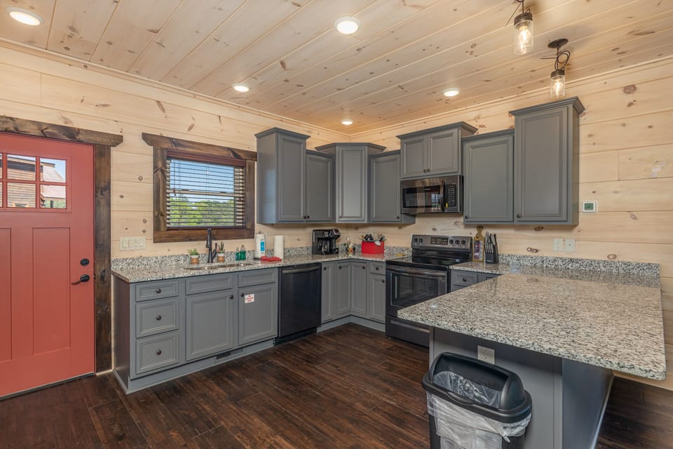 Full kitchen with gray cabinets