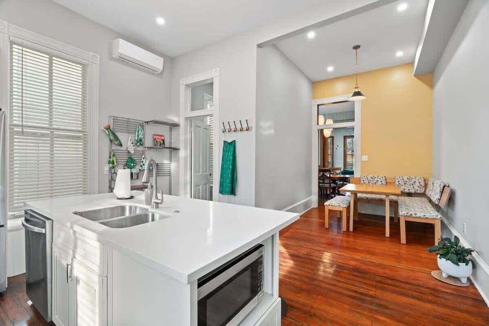 The kitchen has a unique flair to it with plenty of space to make meals! The laundry room is located in the open door shown next to the kitchen. 