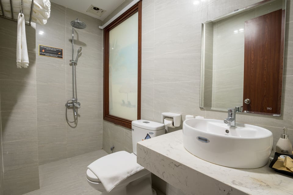 Family Double Room, 2 Queen Beds | Bathroom | Bathtub, designer toiletries, hair dryer, slippers